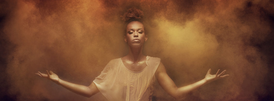 Beautiful,african,american,woman,dancer,posing,over,dust.,concept,of